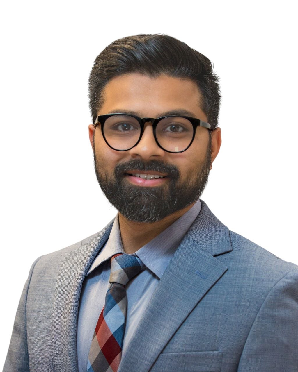 Professional headshot — man in navy suit with argyle tie