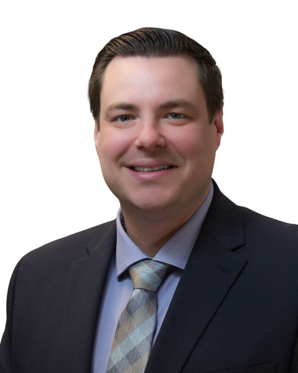 Professional headshot — man in dark suit with geometric tie